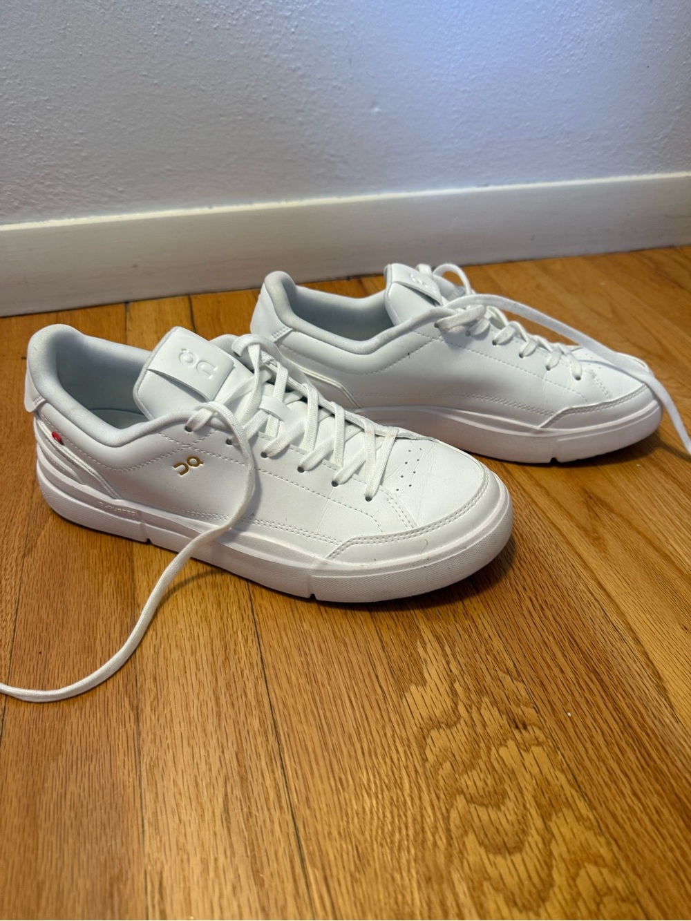 On women’s leather The Roger court Sneakers w/ Subtle Gold accent